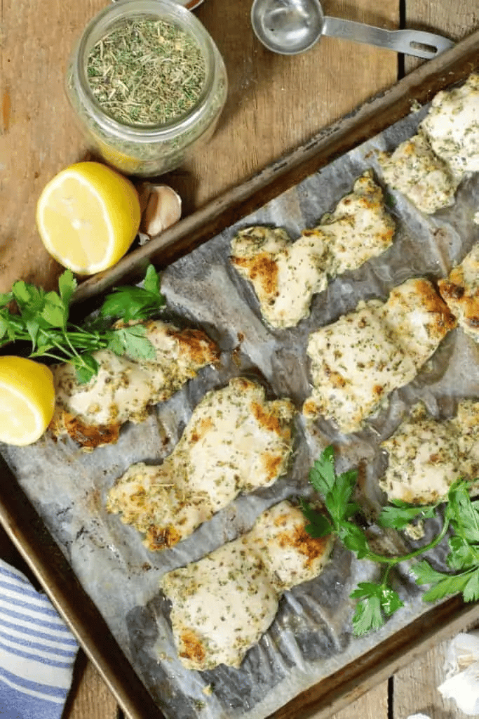 25 Boneless Skinless Chicken Thighs Recipes 4 boneless skinless chicken thigh with greek seasoning on baking sheet lined with foil