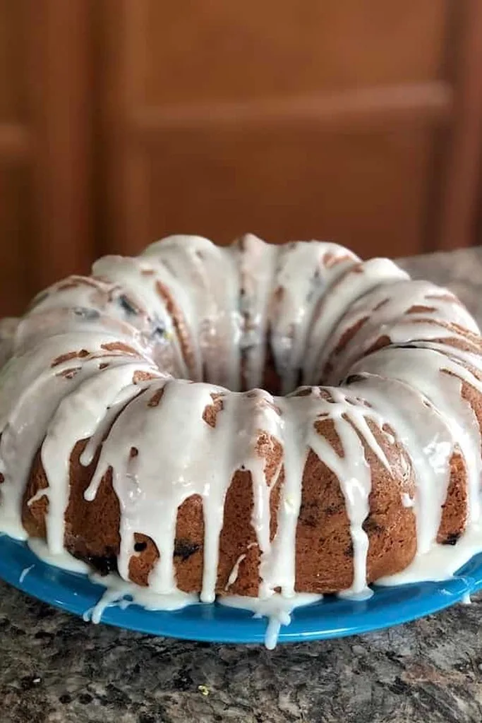25 Box Cake Mix With Pudding Recipes 5 chocolate bundt cake with white icing on blue plate