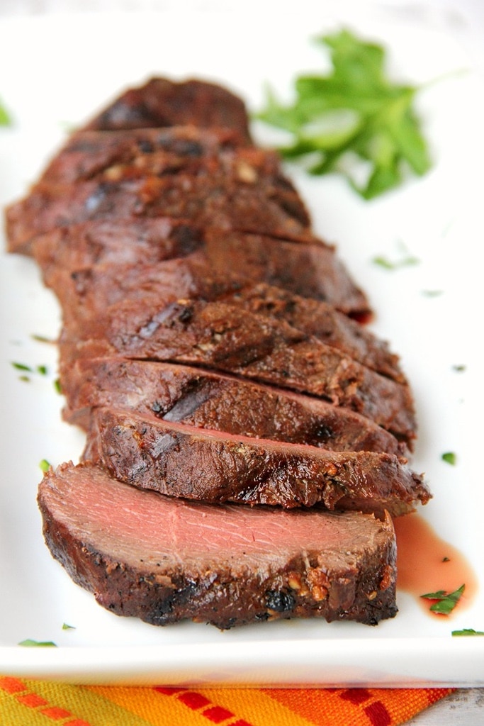 25 Venison Recipes You Will Love 8 sliced grilled venison backstrap on white platter