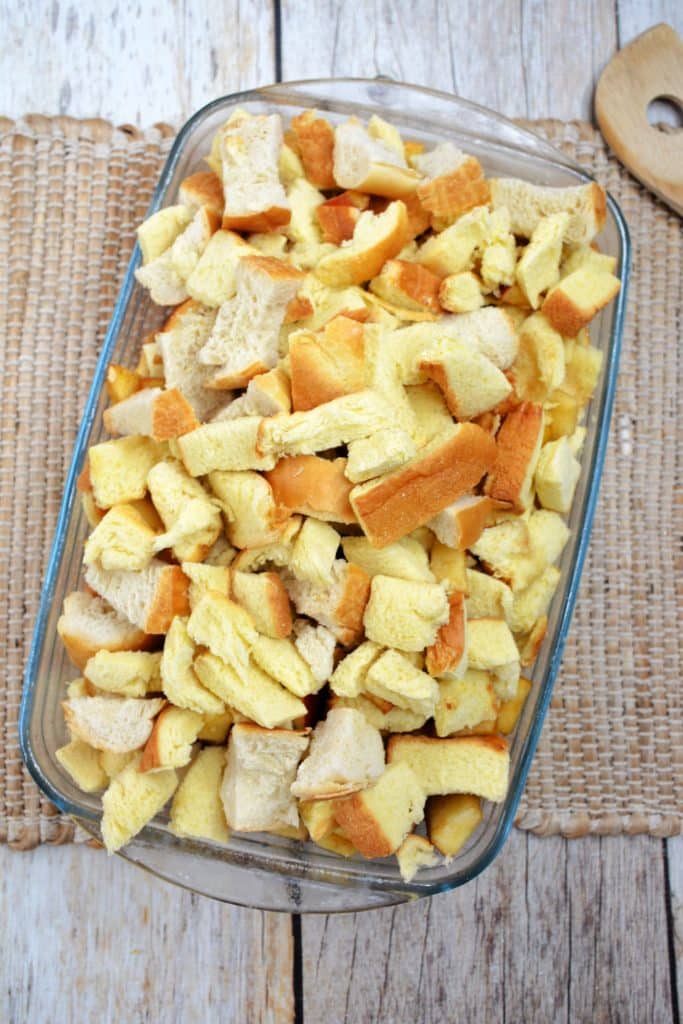 Baked Apple French Toast 10 broken up bread pieces in glass baking dish