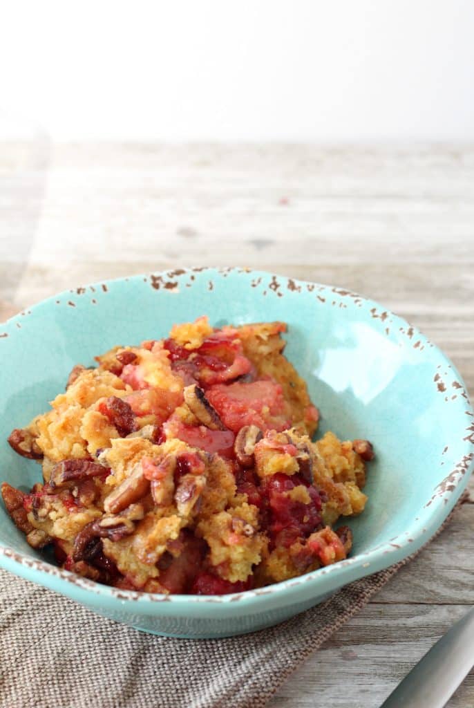 Cherry Pineapple Dump Cake with Pecans 6 close up of cherry pineapple dump cake in blue bowl