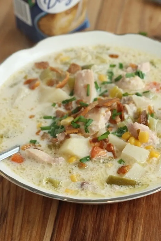 slow cooker chicken corn chowder for Thanksgiving in white bowl 