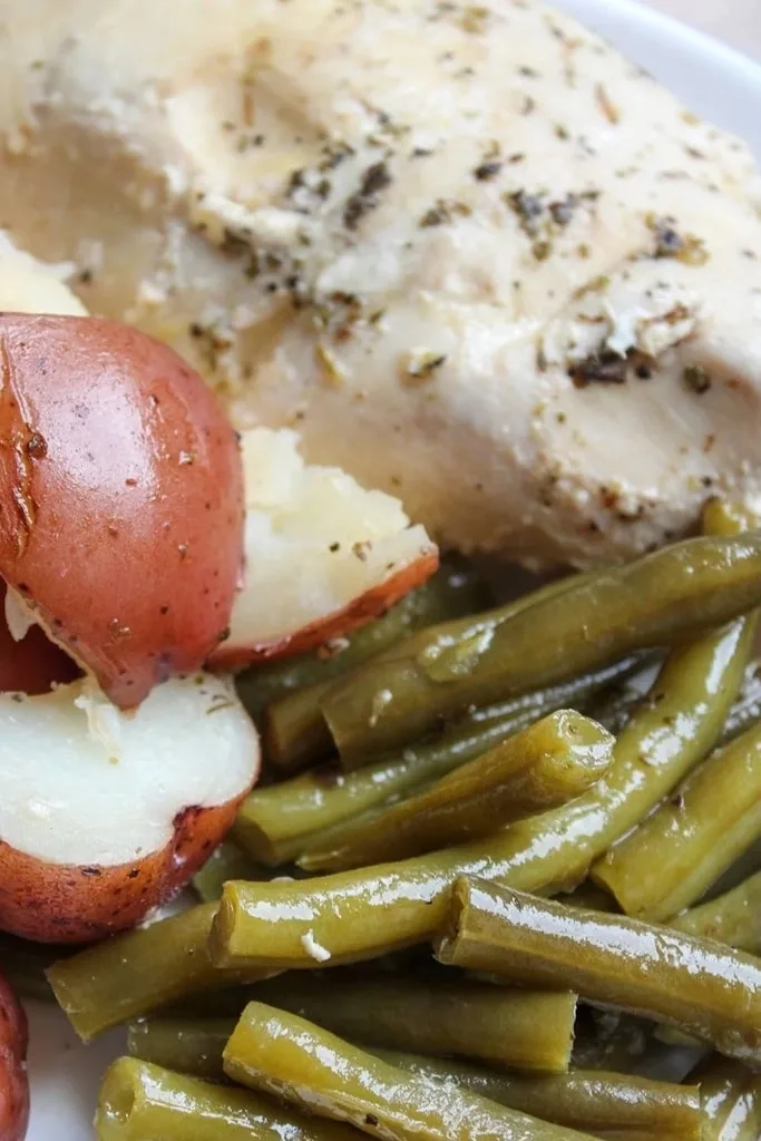chicken poatoes and green beans on white plate 