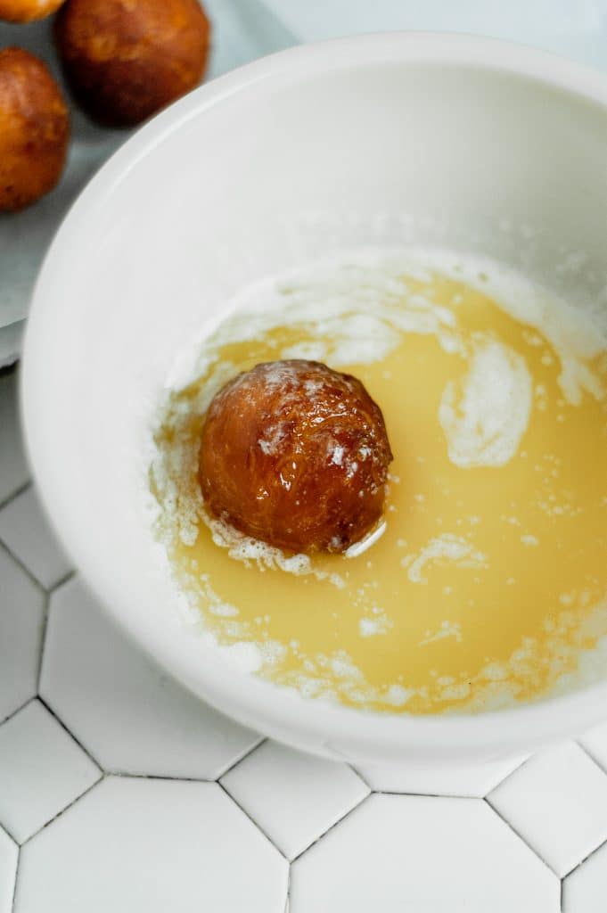 plain donut hole in melted butter