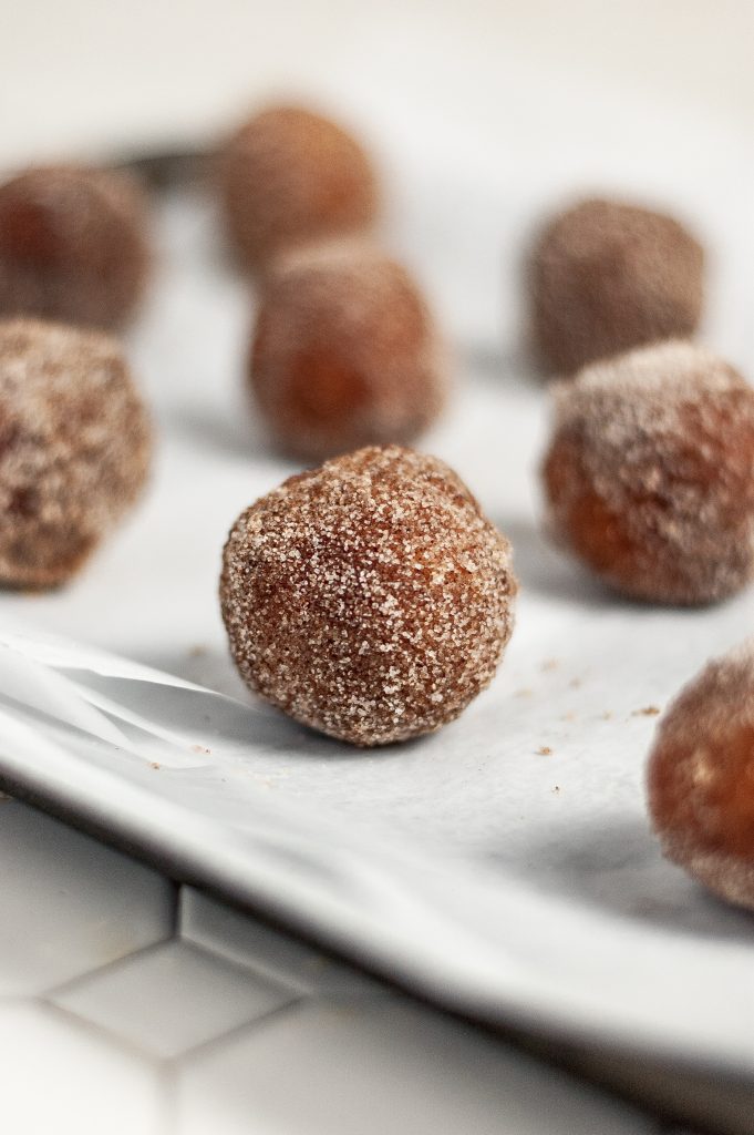 Cinnamon Sugar Donut Holes 32 cinnamon sugar donut hole on parchment paper