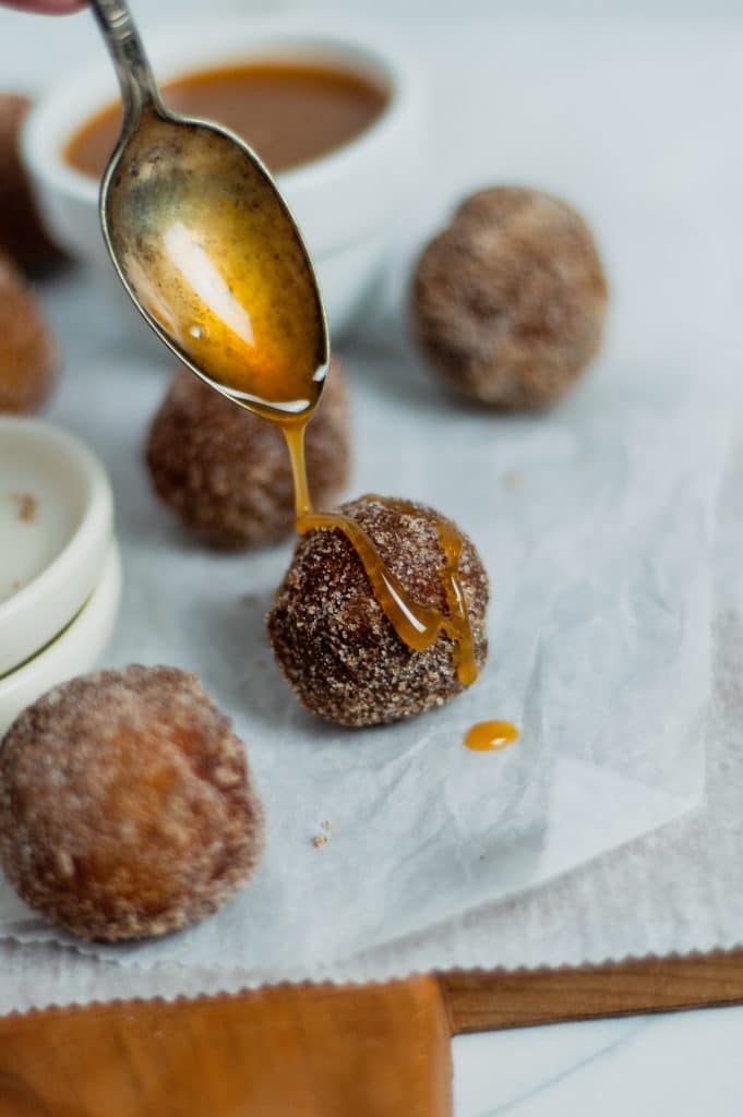 cinnamon sugar donut holes with frizzle over it 