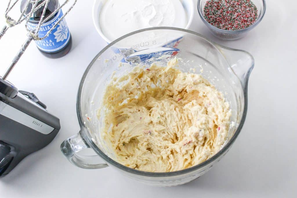 Little Debbie Christmas Tree Cake Dip (Easy No Bake Christmas Dessert) 8 ingredients mixed together in bowl for christmas tree cake dip