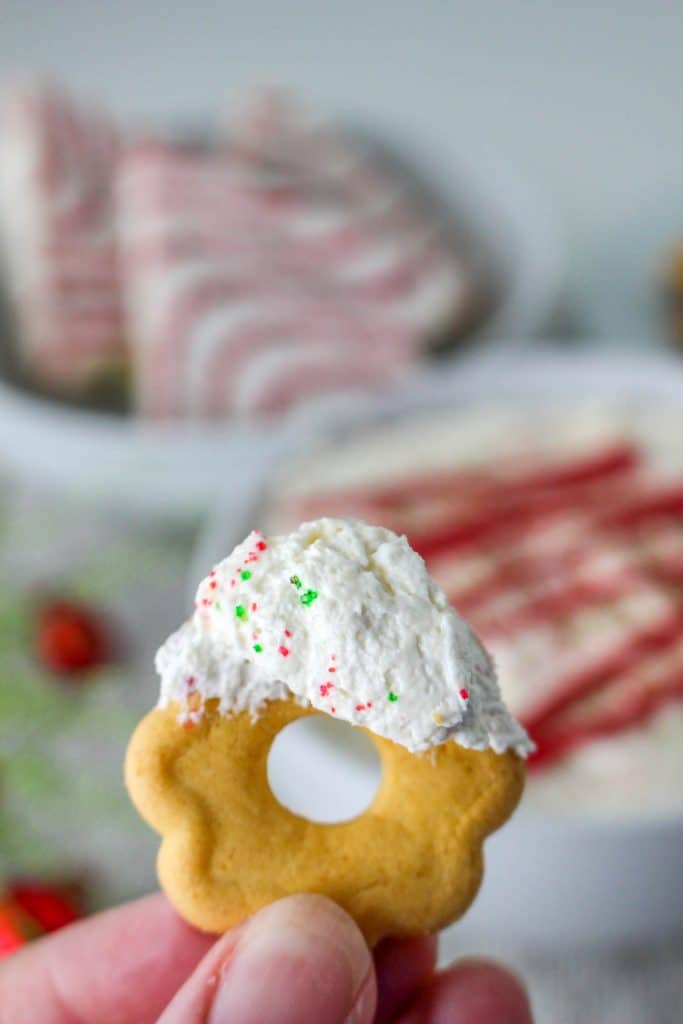 Little Debbie Christmas Tree Cake Dip (Easy No Bake Christmas Dessert) 14 closeup of cookie with little debbie christmas tree cake dip on the cookie