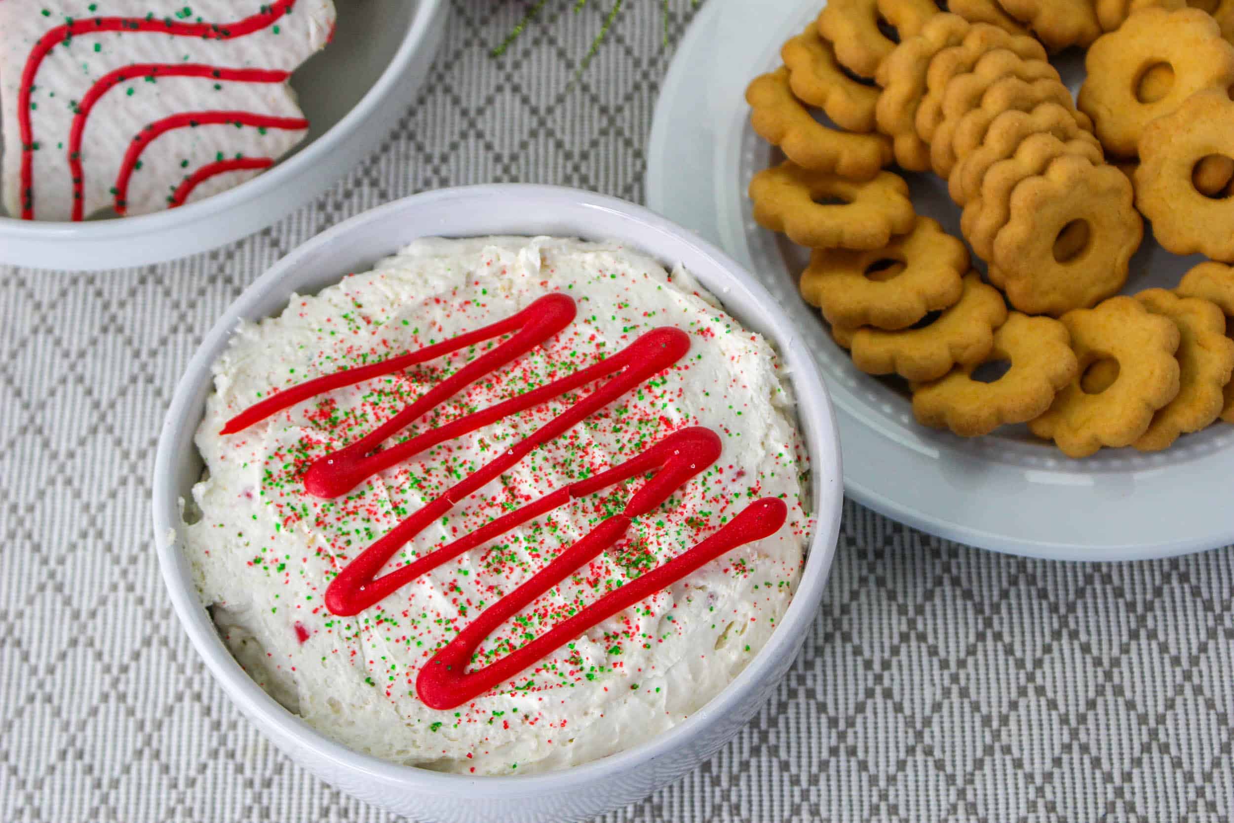 Little Debbie Christmas Tree Dip in bowl with cookies in bowl beside of it