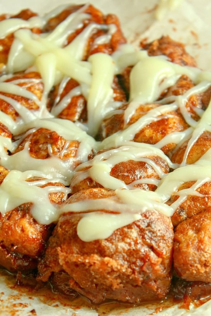 Slow Cooker Thanksgiving Recipes 19 pumpkin monkey bread with cream cheese icing drizzled over