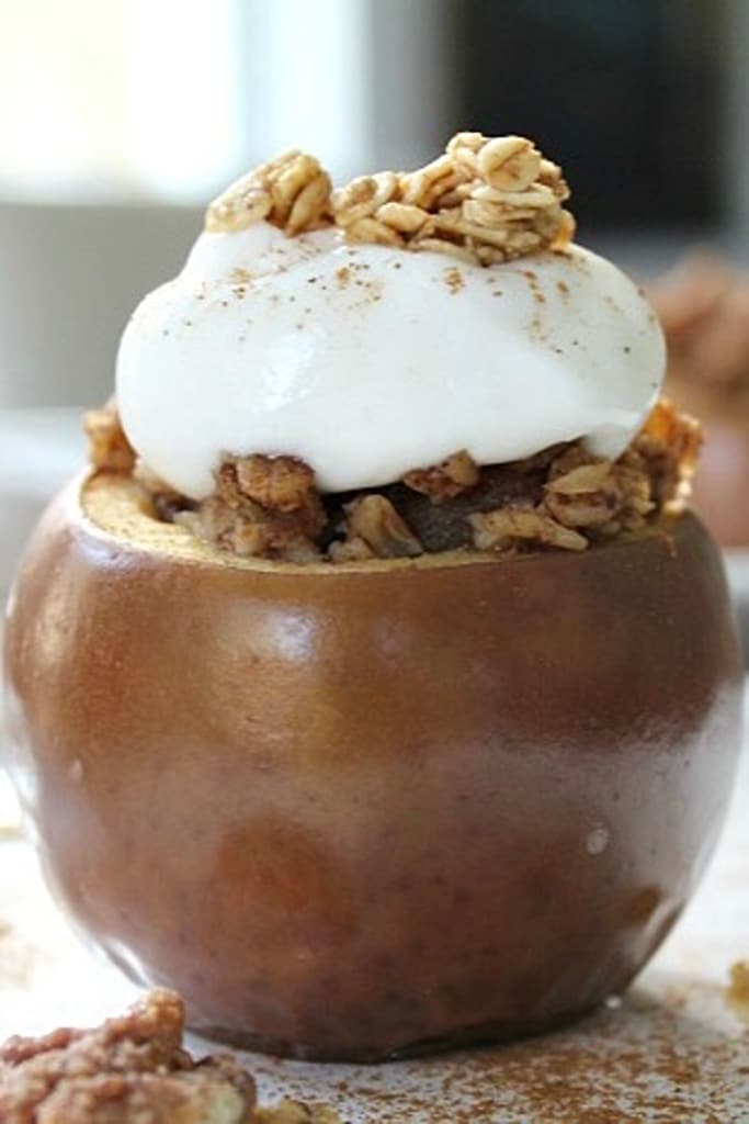 slow cooker baked apples topped with whipped cream 