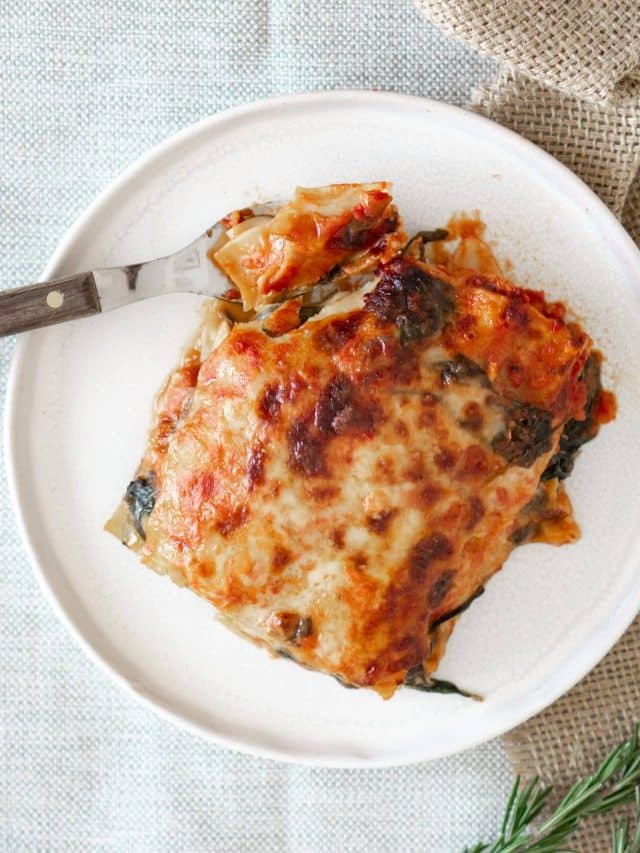 Mom's Easy Lasagna with Cottage Cheese 9 square serving of lasagna on white plate with silver fork