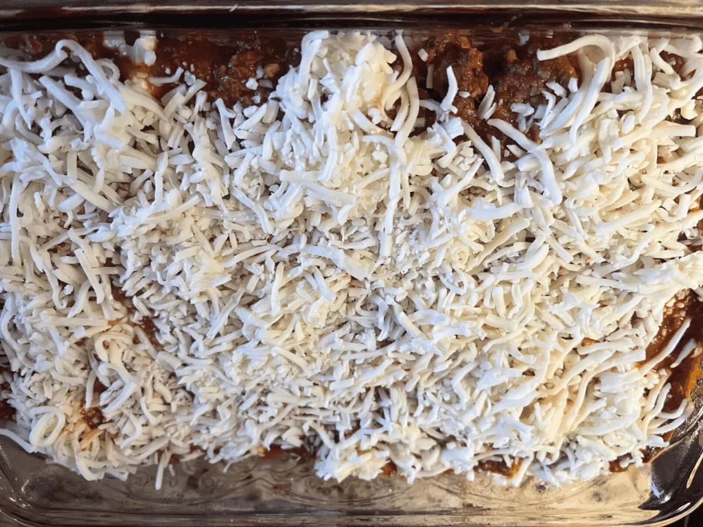 shredded cheese on top of lasagna prior to baking