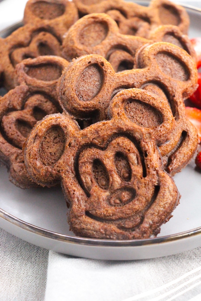 Chocolate Mickey Mouse Waffles 7 close up of a plate of cooked Mickey Mouse waffles