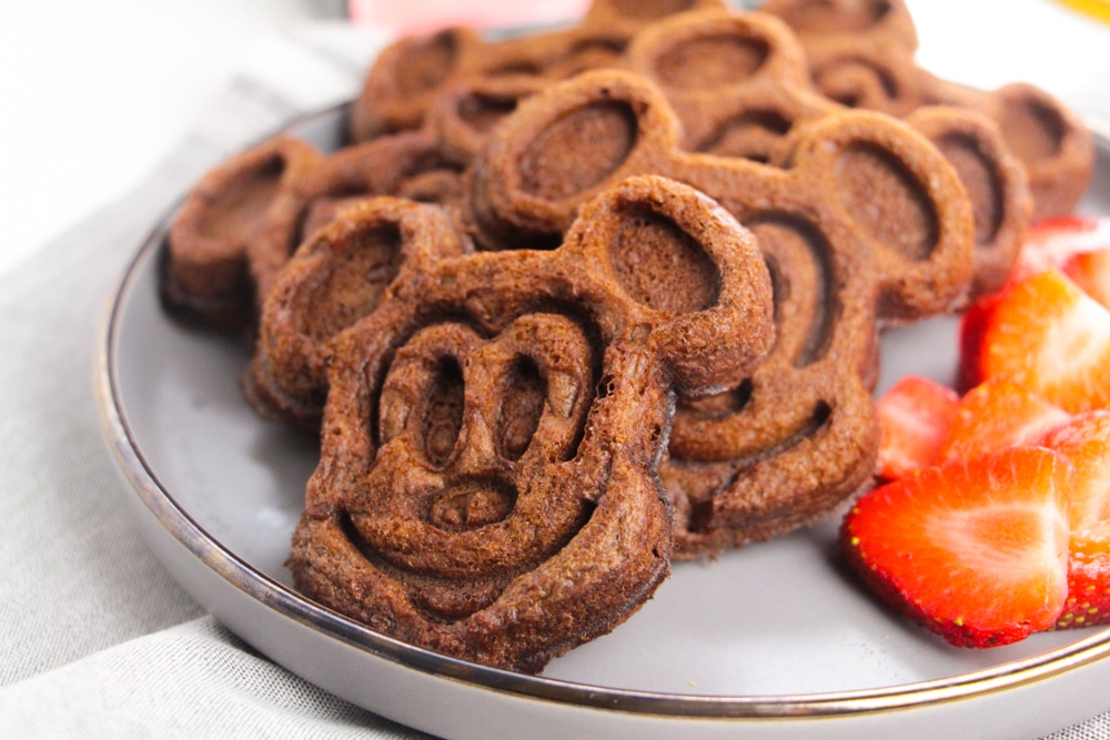 Chocolate Mickey Mouse Waffles 9 white plate of cooked Mickey Mouse waffles
