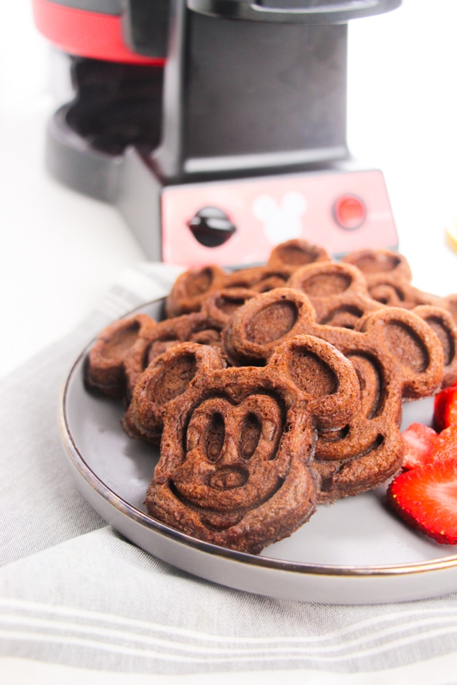 Chocolate Mickey Mouse Waffles 10 white plate of cooked Mickey Mouse waffles