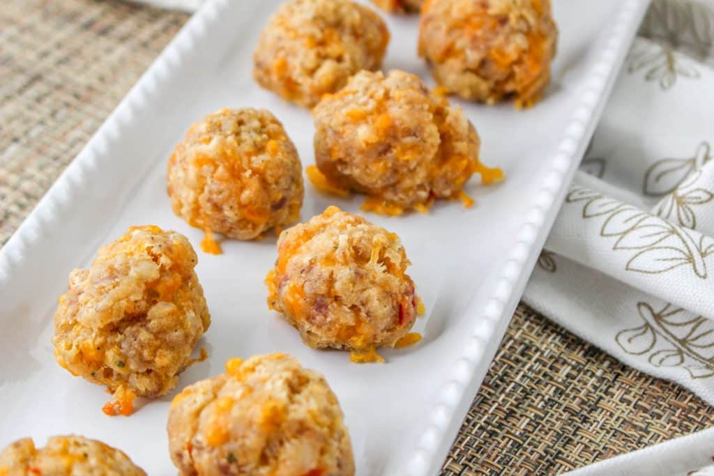 3 Ingredient Sausage Cheese Balls with Pimento Cheese 6 Pimento Cheese Sausage Balls on white rectangle serving tray