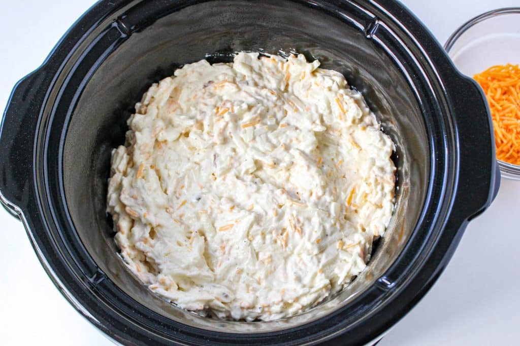 Slow Cooker Cracker Barrel Cheesy Hash Brown Casserole 14 Slow Cooker Cracker Barrel Cheesy Hash Brown Casserole mixed ingredients in crockpot