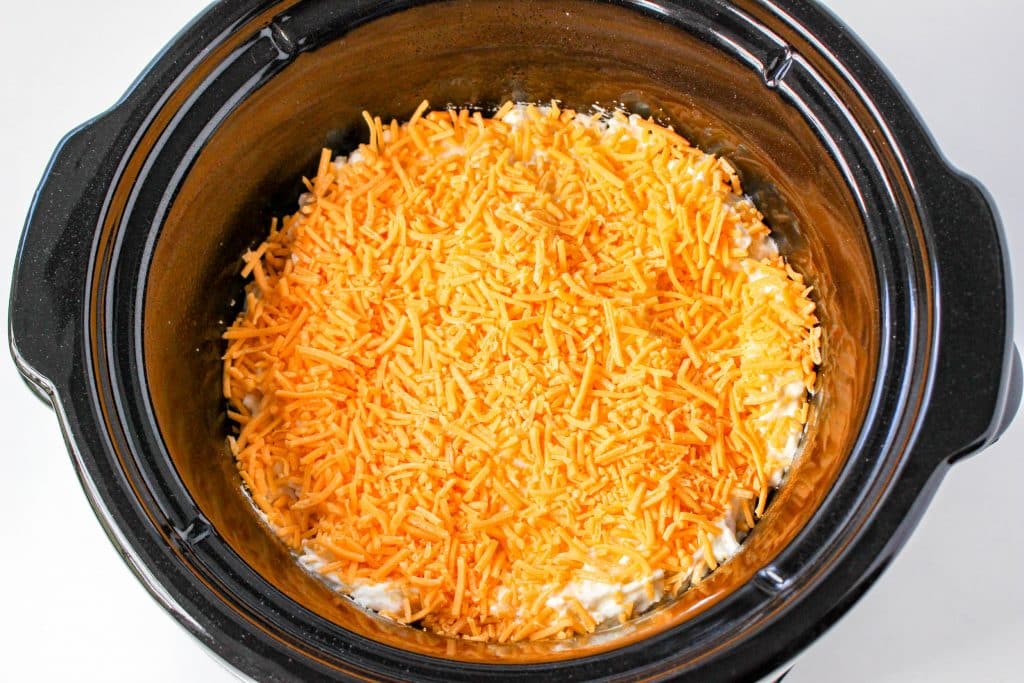 Slow Cooker Cracker Barrel Cheesy Hash Brown Casserole 17 Slow Cooker Cracker Barrel Cheesy Hash Brown Casserole in crockpot with cheese on top
