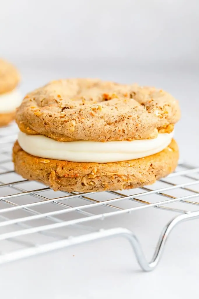 close up of one fully baked Carrot Cake Mix Cookie Sandwiches on wire cooling rack