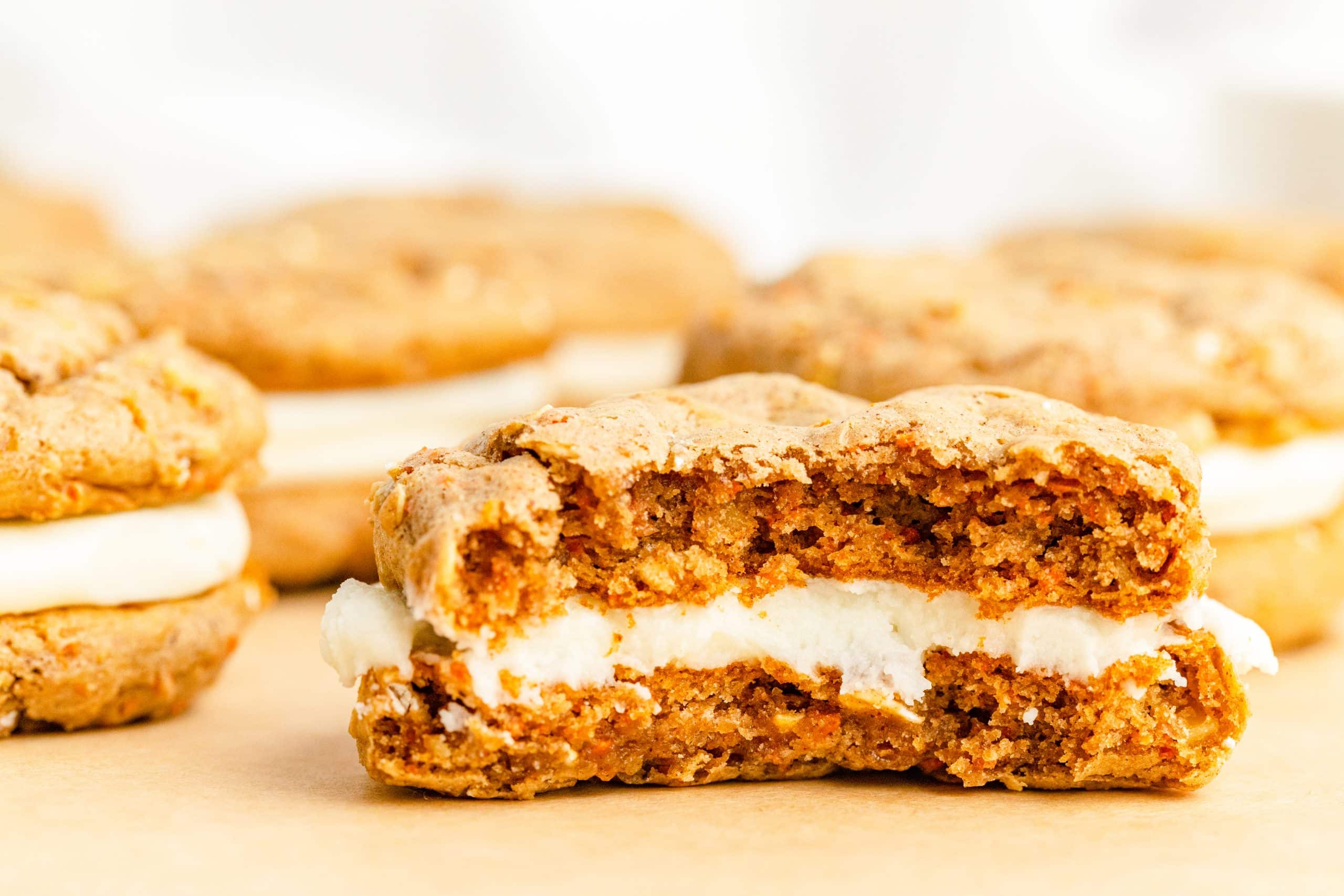 Close up of center of Carrot Cake Mix Cookie Sandwiches with frosting