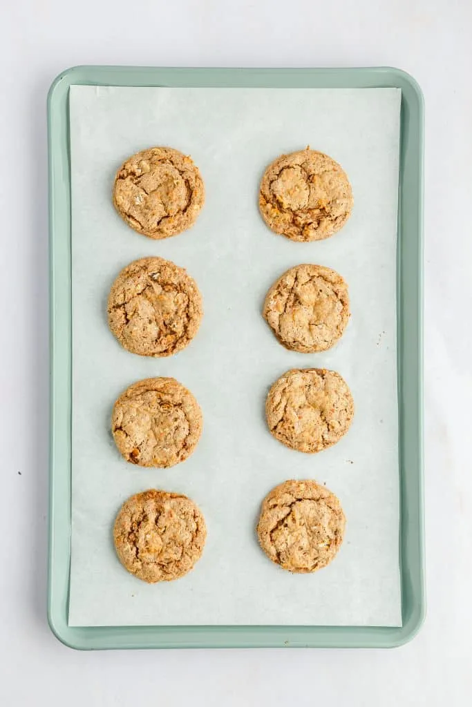 Carrot Cake Mix Cookie Sandwiches on parchment paper covered baking sheet