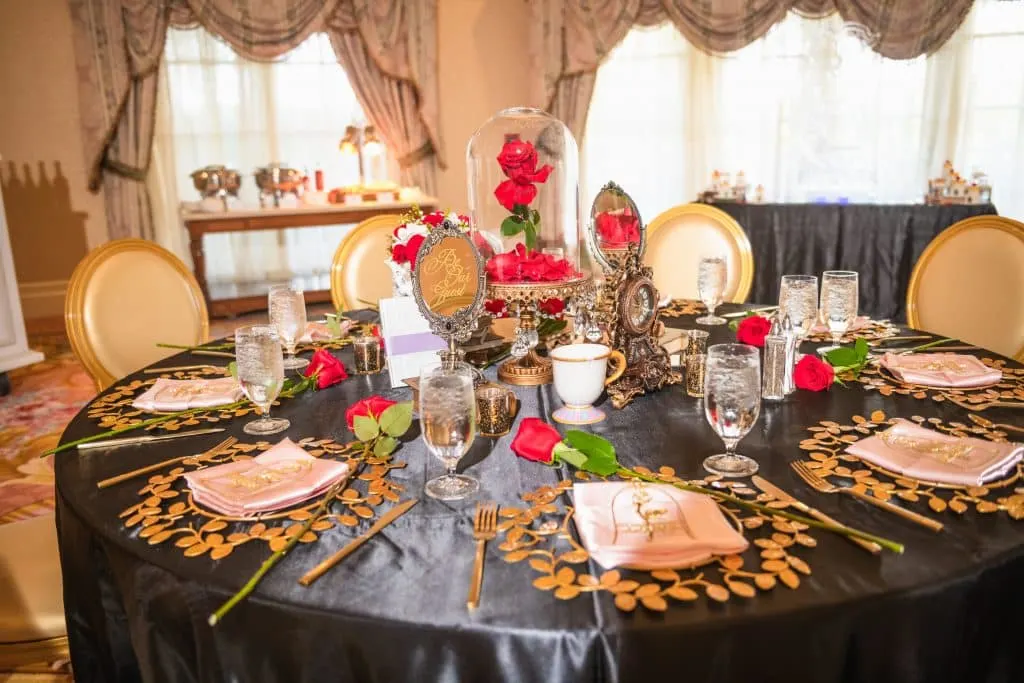 Everything You Need to Know About a Disney World Vow Renewal 10 Beauty and the Beast Table Set up for Disney Wedding