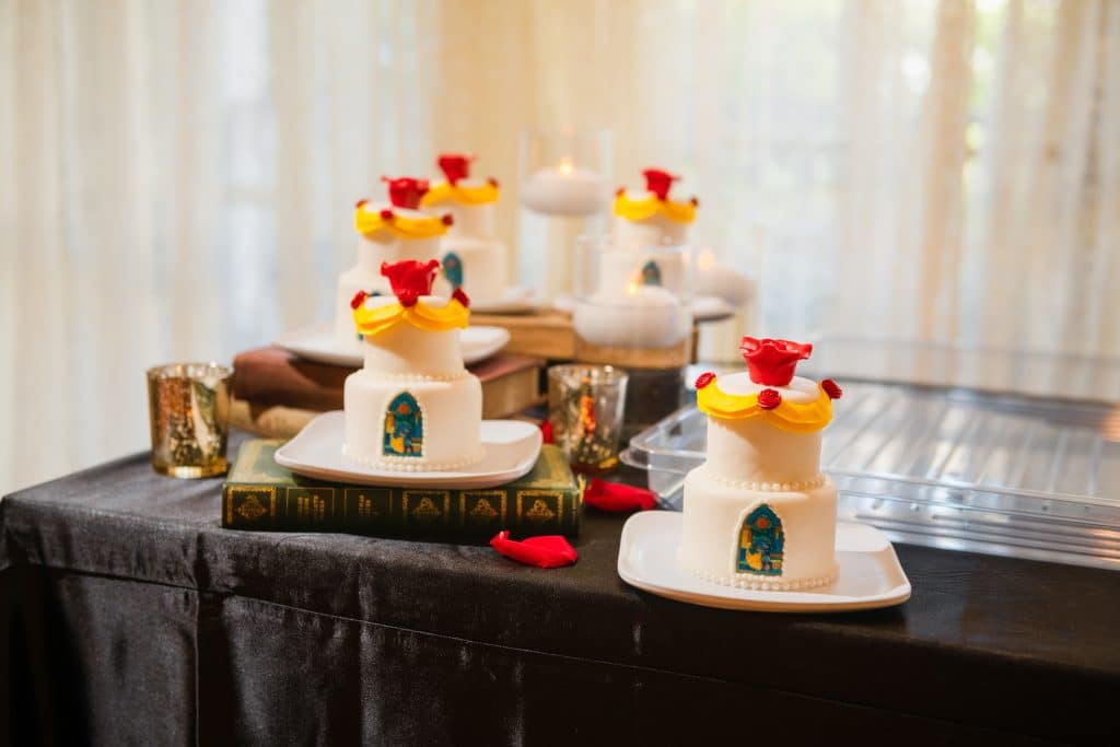 Everything You Need to Know About a Disney World Vow Renewal 42 Beauty and the Beast Table Set up for Disney Wedding