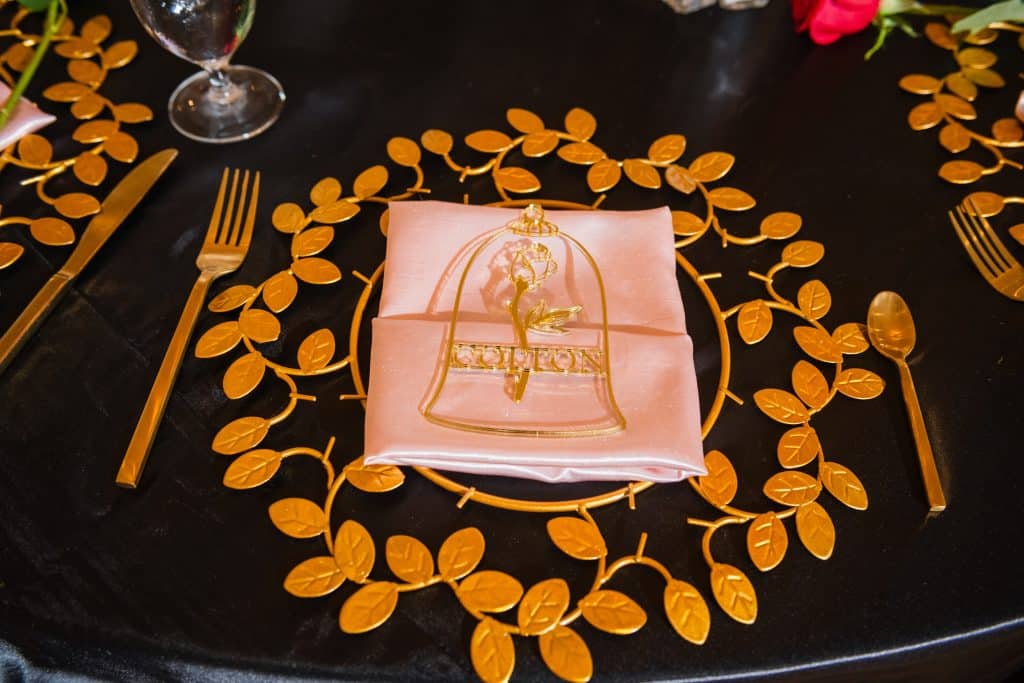 Everything You Need to Know About a Disney World Vow Renewal 43 Beauty and the Beast Table Set up for Disney Wedding
