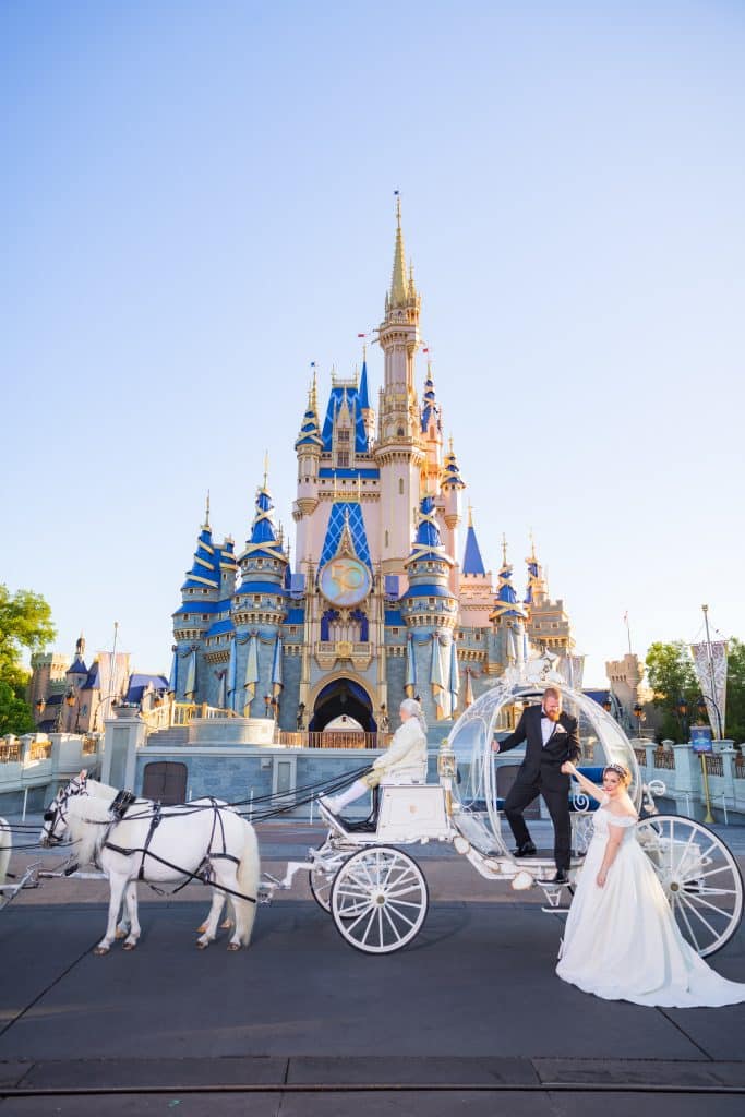 Everything You Need to Know About a Disney World Vow Renewal 44 bride and groom in front of Cinderella's Carriage at Disney World