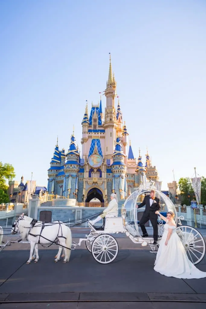 bride and groom in front of Cinderella's Carriage at Disney World 
