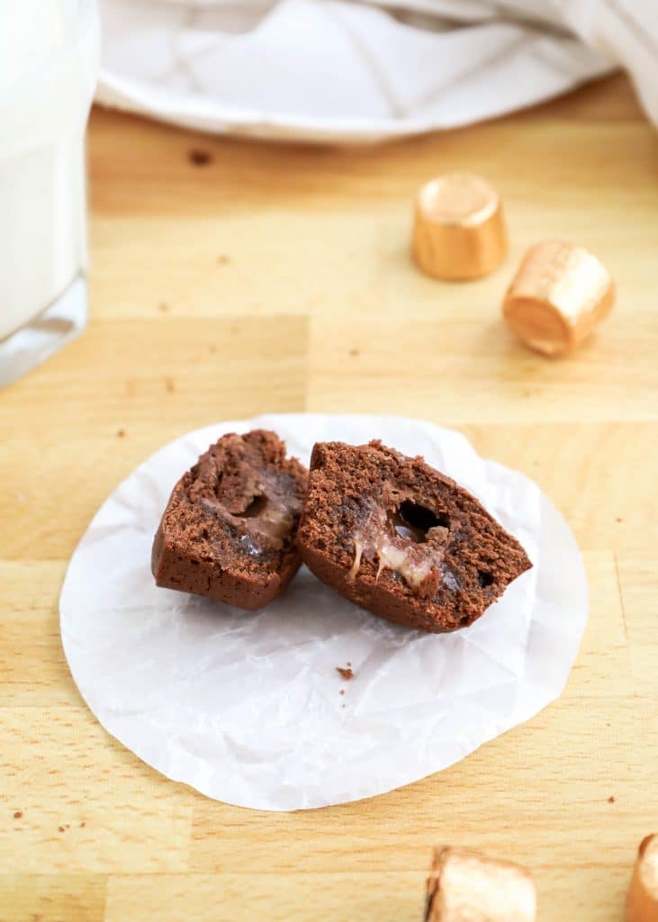 Easy Rolo Brownie Bites 10 rolo brownie bite cut in half on white parchment paper