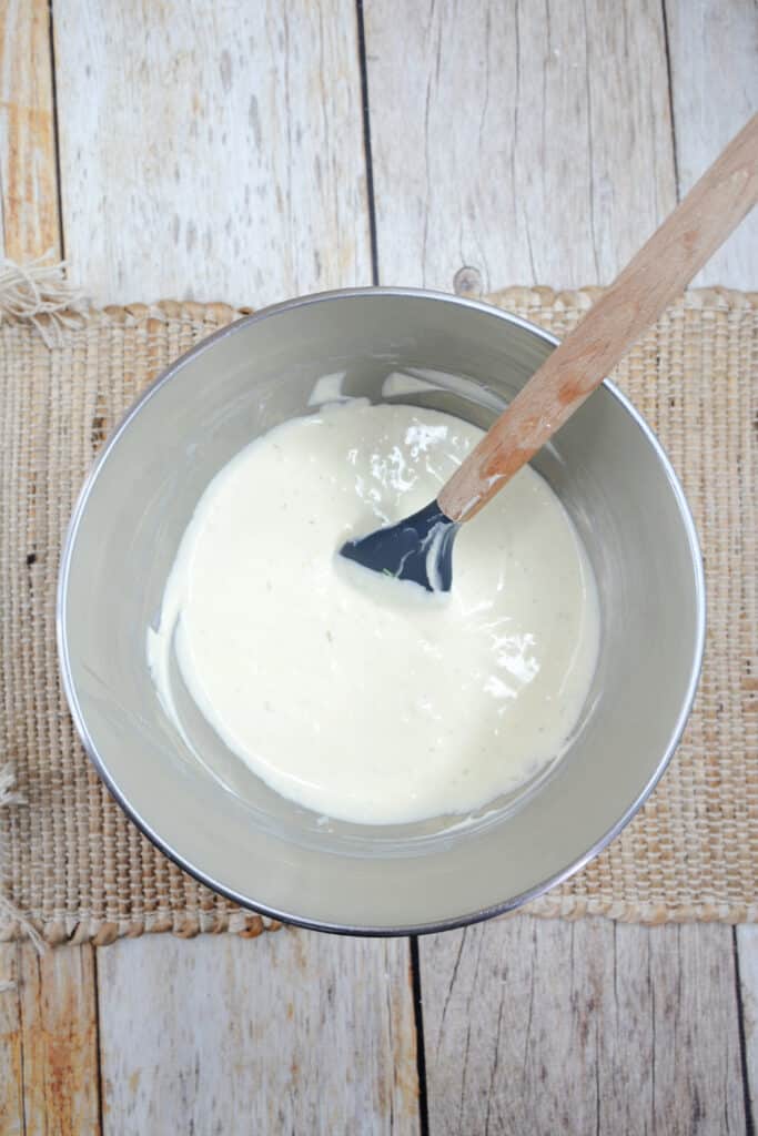 Mini Key Lime Cheesecakes 6 key lime pie cheesecake mixture in metal bowl.