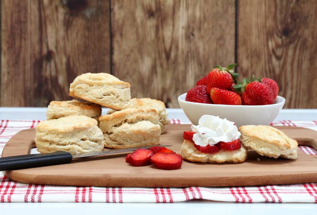Strawberry Shortcake Biscuits with Refrigerated Biscuits 4 strawberry shortcake biscuits on cutting board with knife