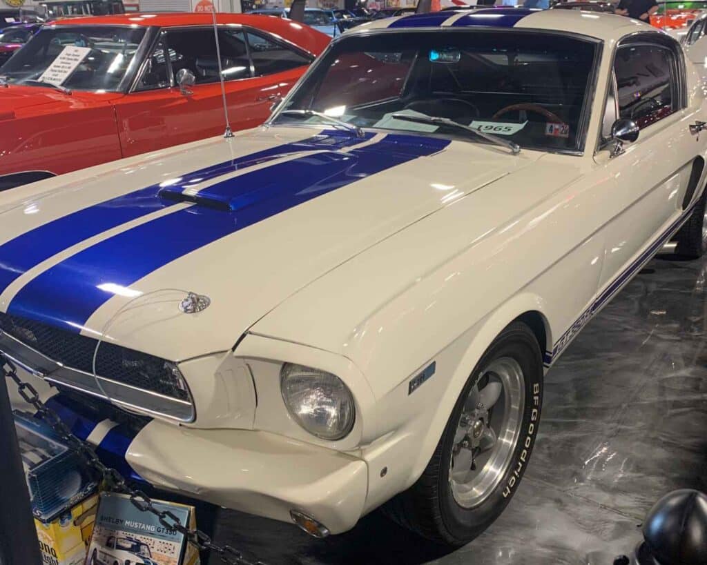 Top 7 Auto Museums In Florida That Are A Must Visit 5 classic blue and white 1965 mustang in auto museums in Florida.