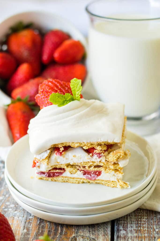 Easy Strawberry Icebox Cake 12 strawberry ice box cake on white place with strawberries in background