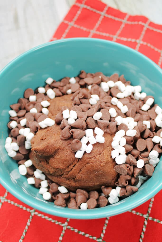 Santa's Cookies (Red Velvet Christmas Cookies) 6 Bowl with chocolate cookie dough, chocolate chips. and mini marshmallows.