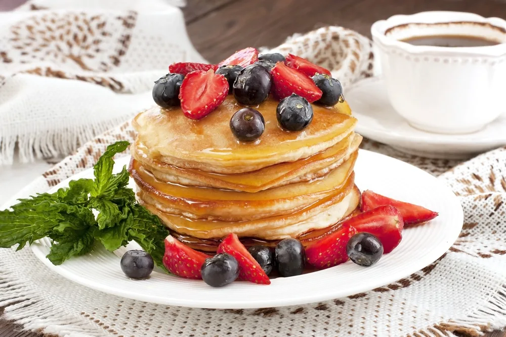 Best Breakfast Places in Gatlinburg, Tennessee 3 Stack of pancakes on table in best breakfast places in Gatlinburg