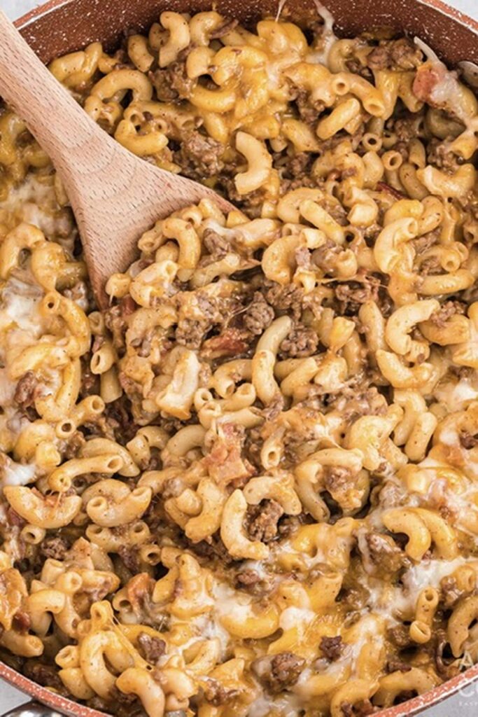 25 Venison Burger Casserole Recipes 9 Bacon cheeseburger pasta bake with wooden spoon.