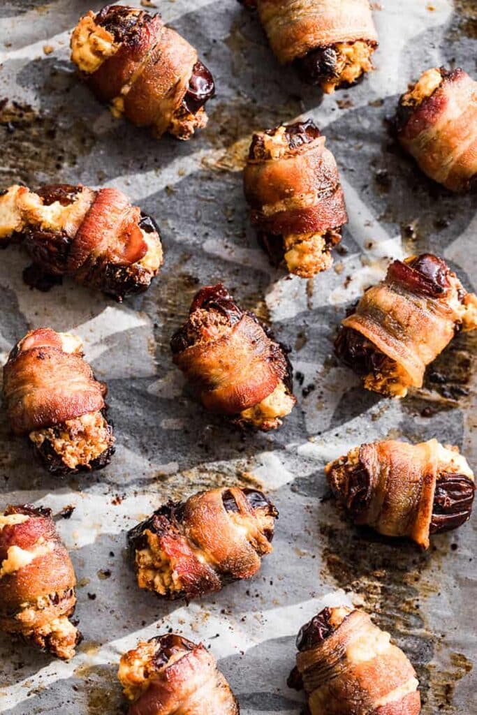25 Christmas Appetizers That Travel Well 33 Overhead of bacon wrapped chorizo dates.