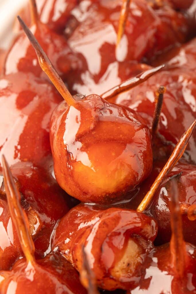 25 Christmas Appetizers That Travel Well 56 Close up of bacon wrapped water chestnuts.