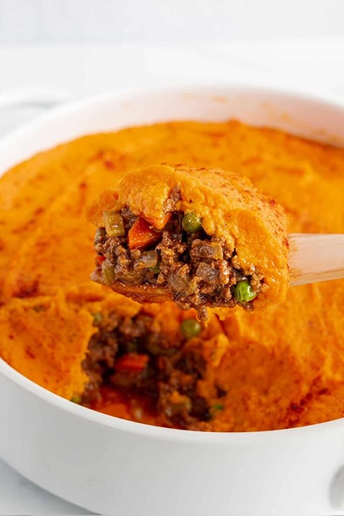 25 Venison Burger Casserole Recipes 16 Sweet Potato Shepherd's Pie in a white casserole dish.