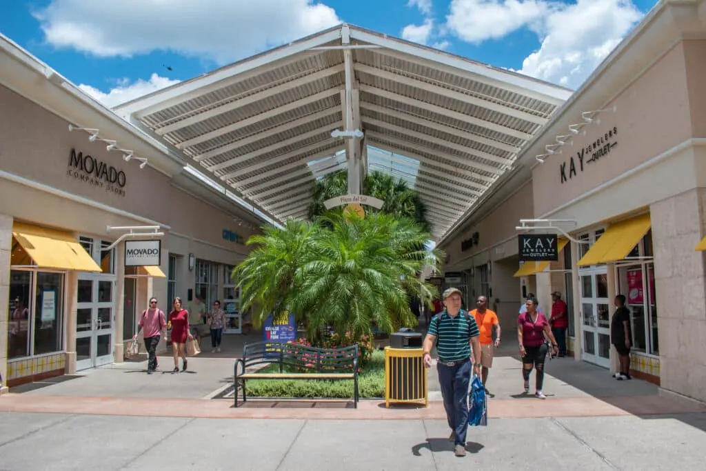 Vineland premium outlets in Orlando Movado and Kay Jewelers Stores with people walking in front of them. 