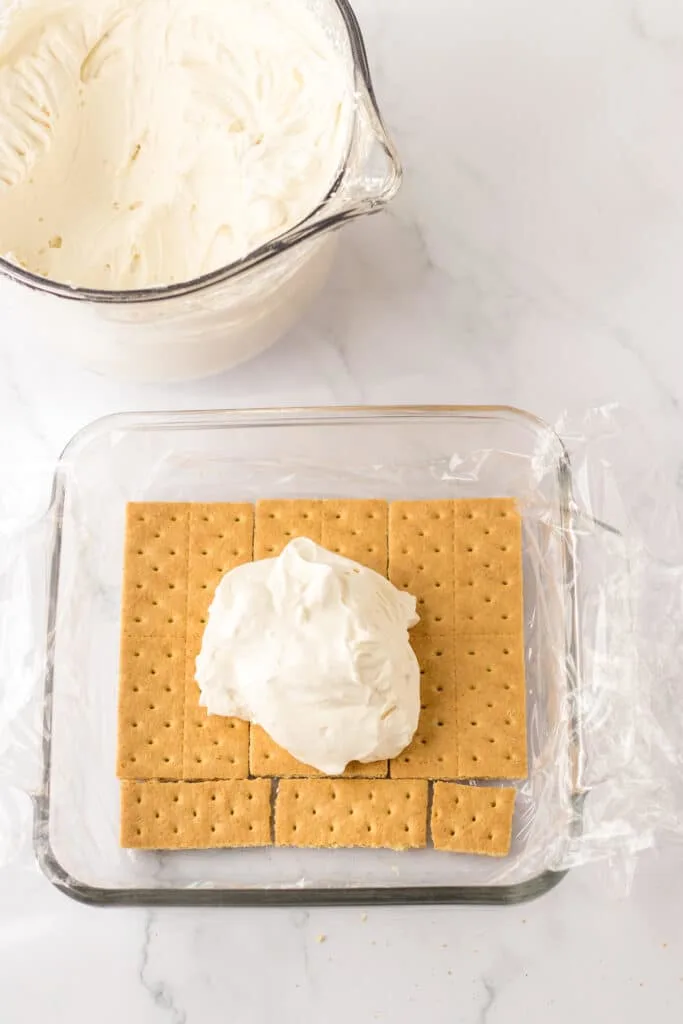 sheet of graham crackers topped with heavy whipped cream