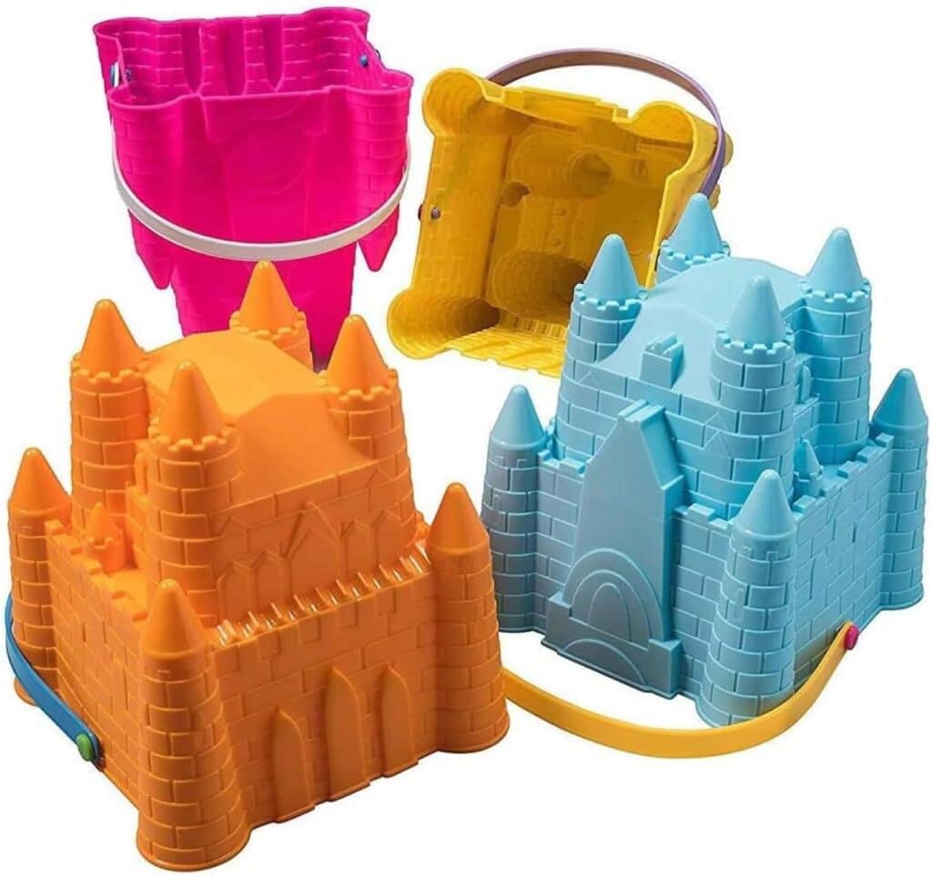 Colorful castle pails for sand castle making against a white background. 