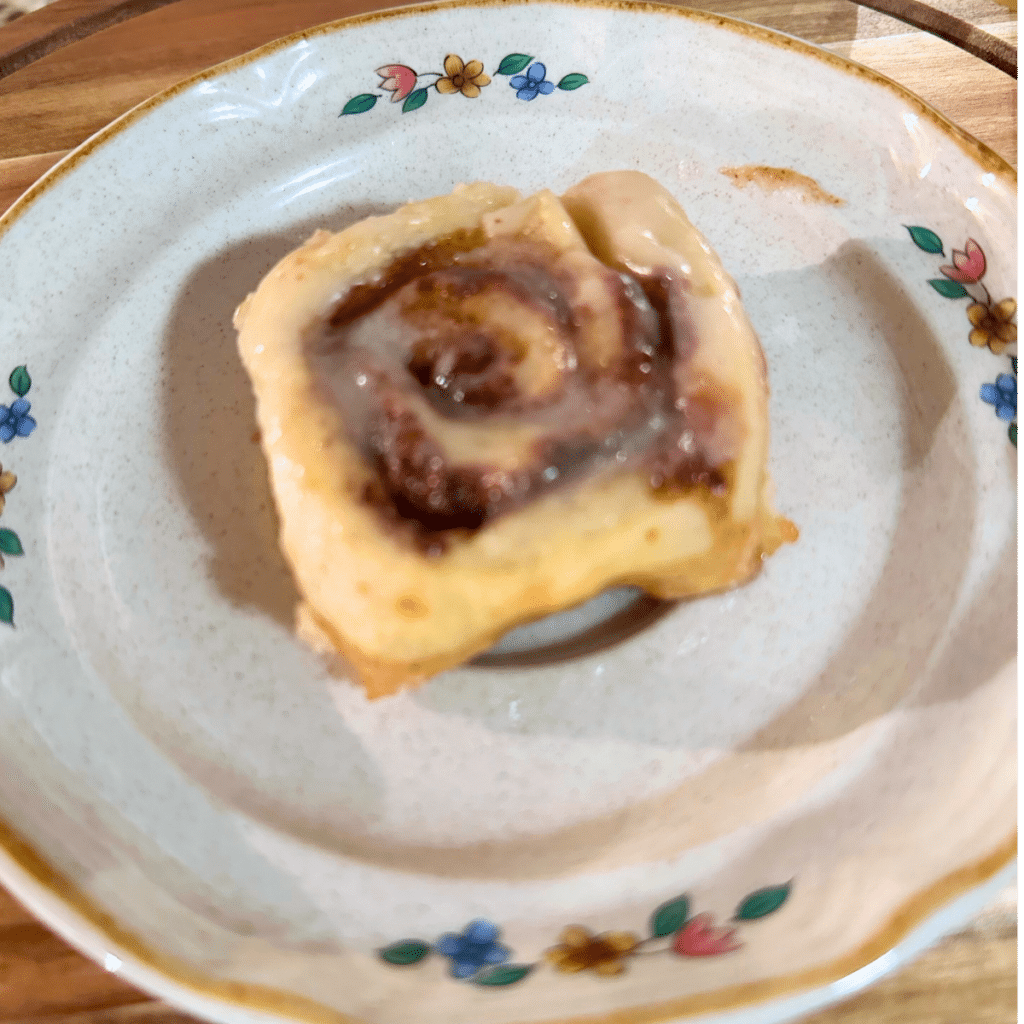 Mini Sourdough Cinnamon Rolls 4 Mini sourdough cinnamon roll on small plate.
