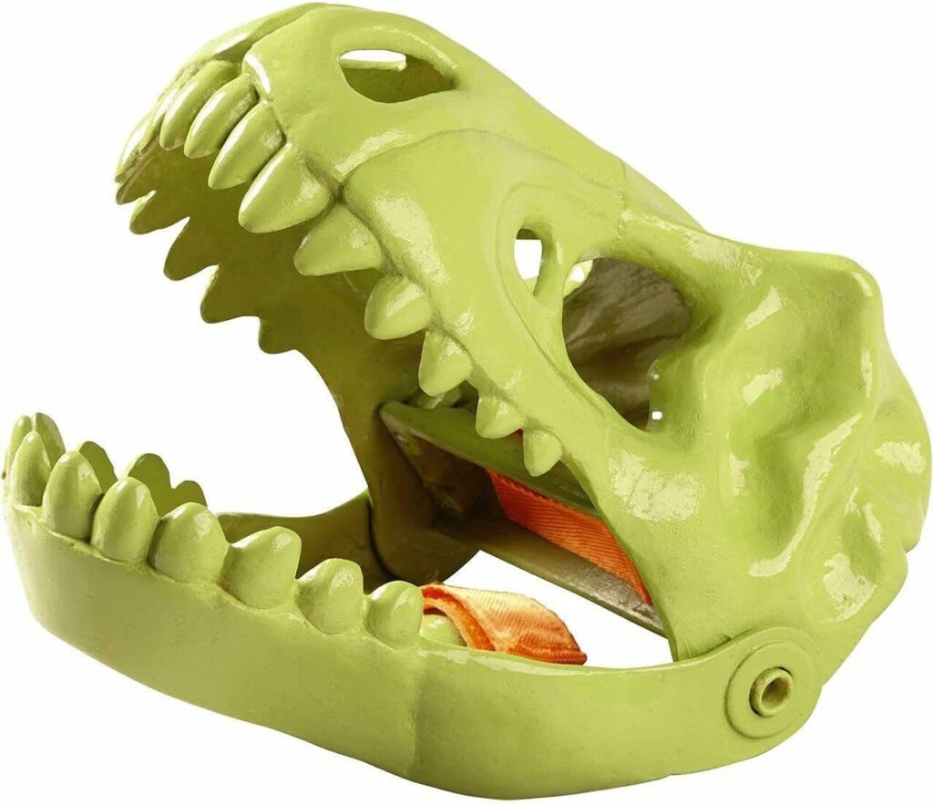 A dinosaur glove against a green background.