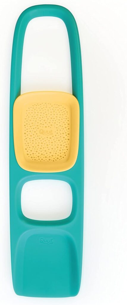 A teal sand shovel against a white background.
