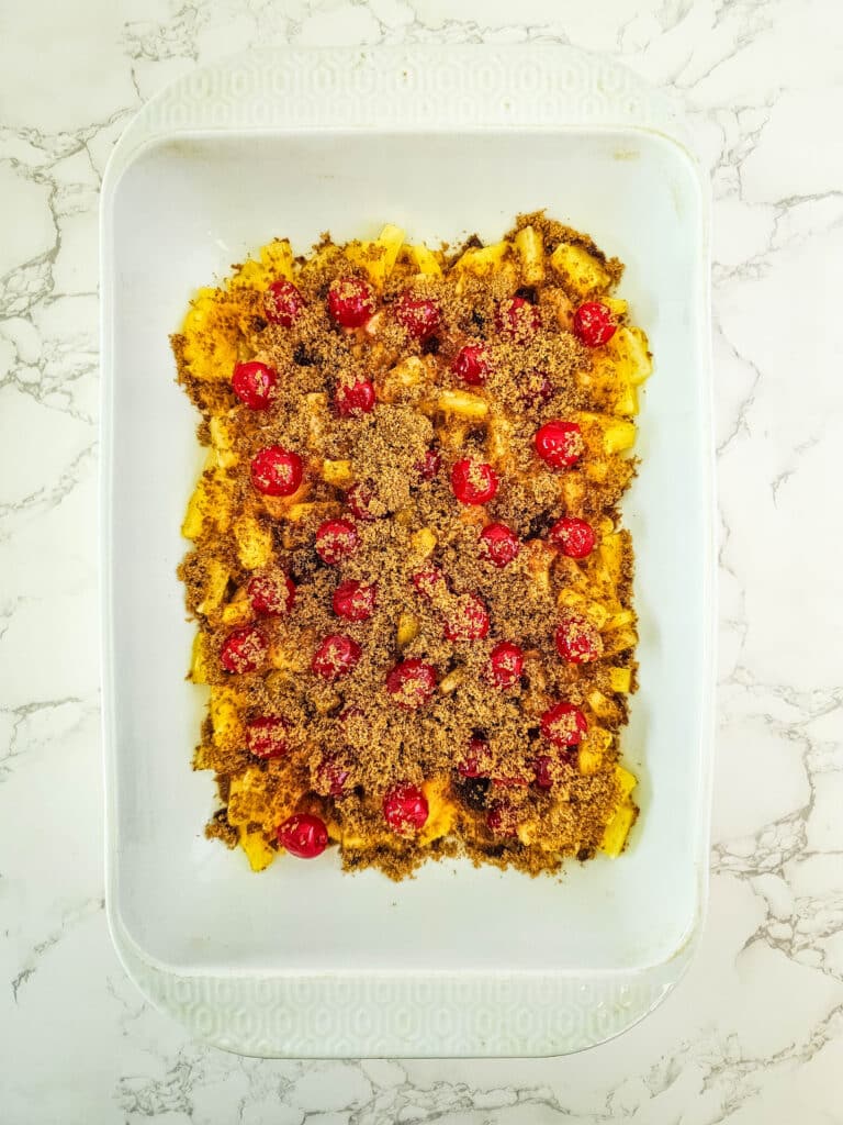 Pineapple Upside Down Dump Cake 6 pineapple, cherries and brown sugar in baking dish