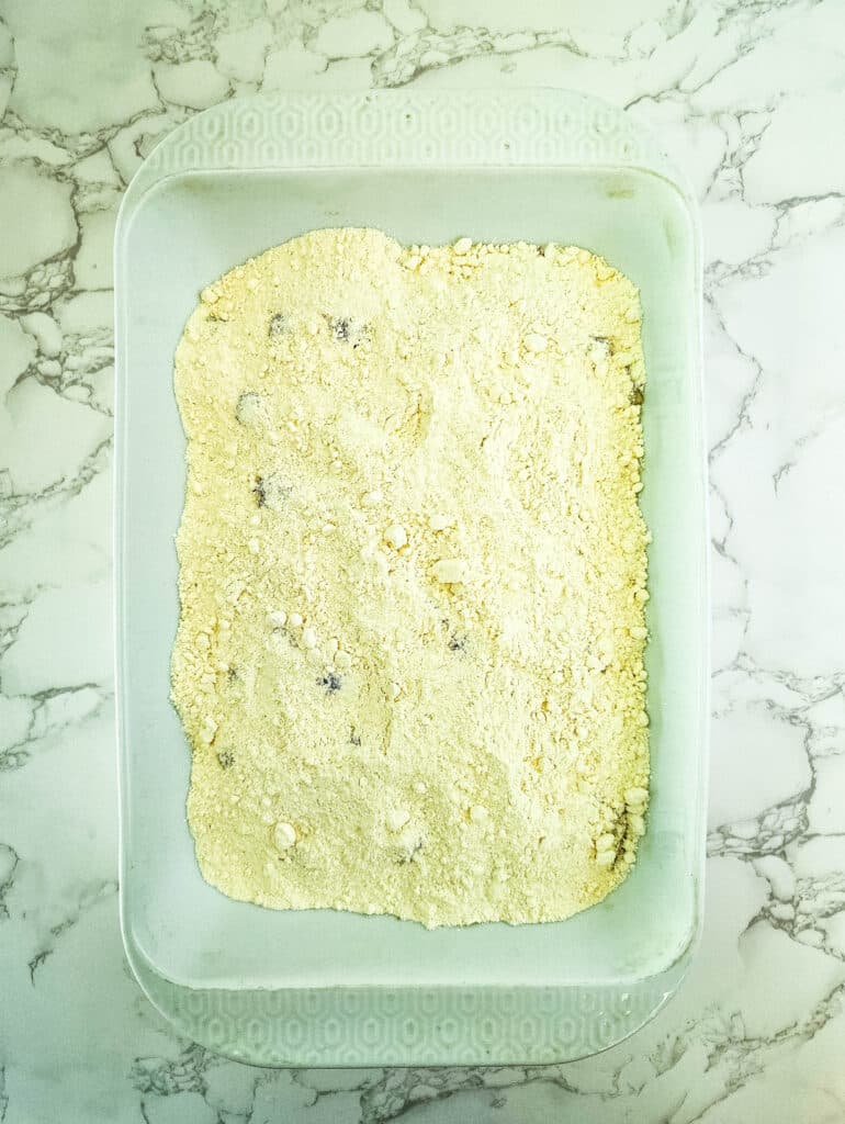 Pineapple Upside Down Dump Cake 7 cherries, pineapple, brown sugar and cake mix in baking sheet
